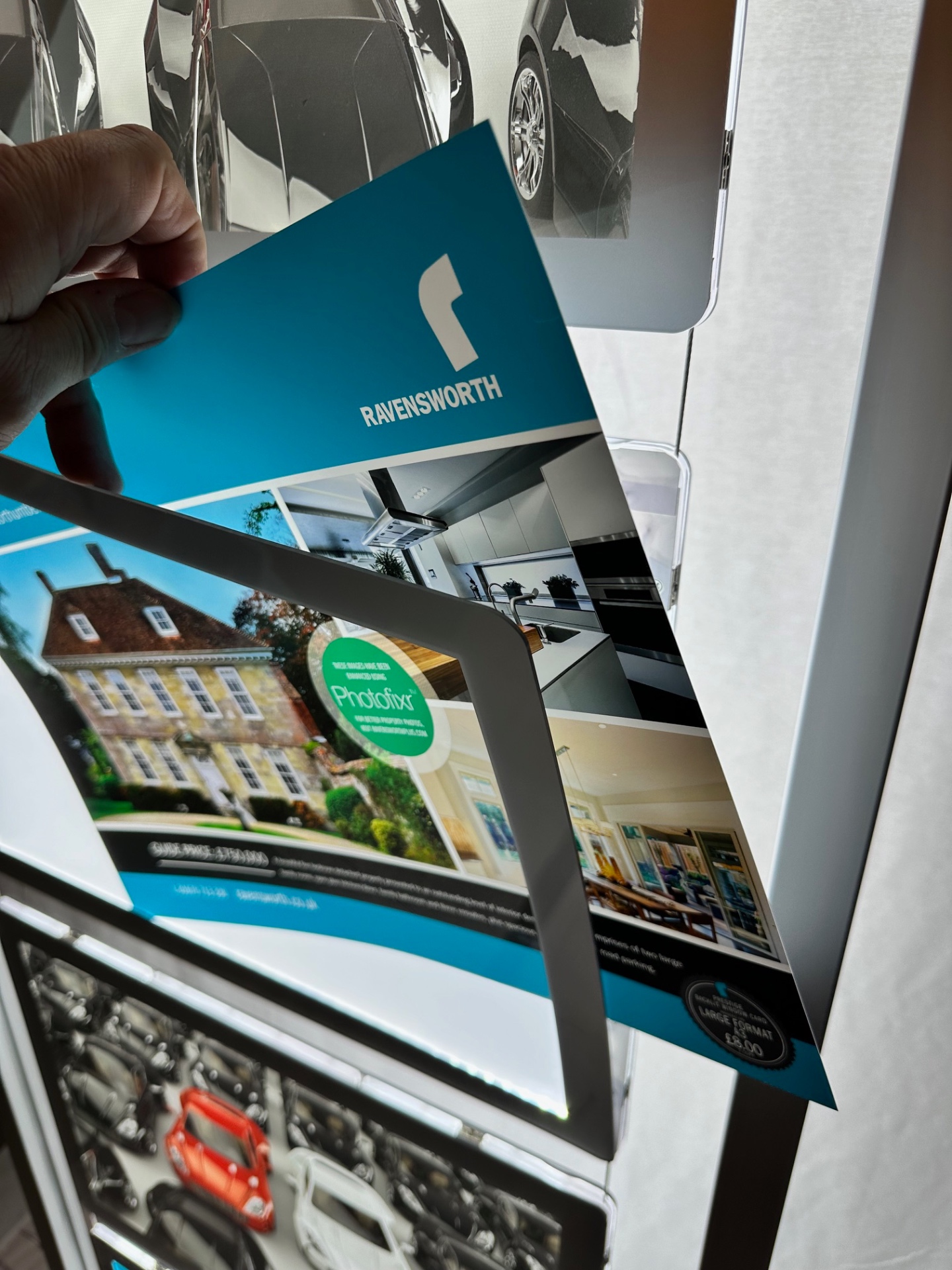 Swapping out a printed poster in the freestanding LED frame